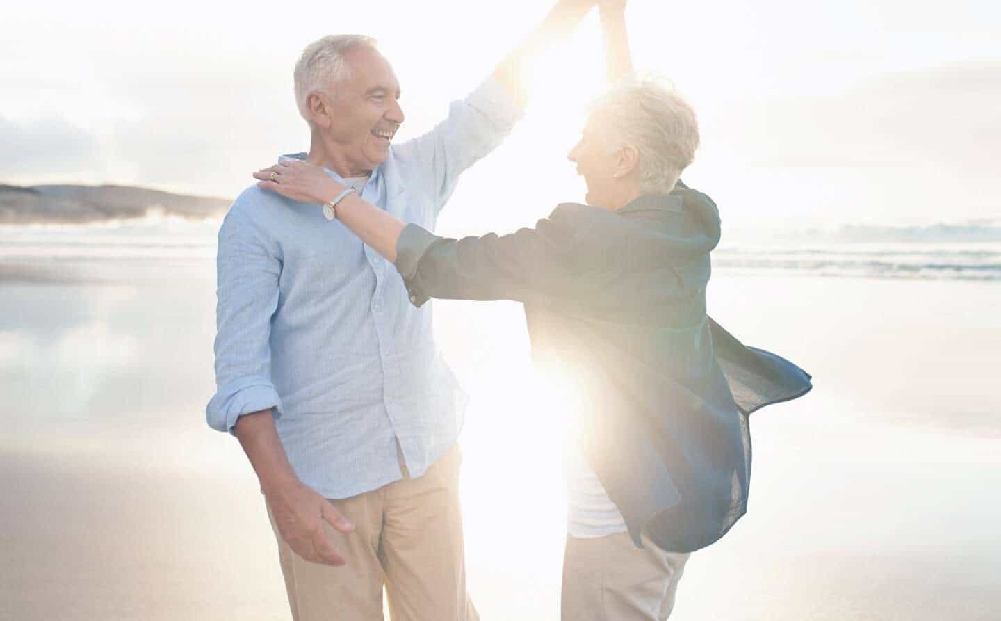 Couple on the beach enjoying retirement