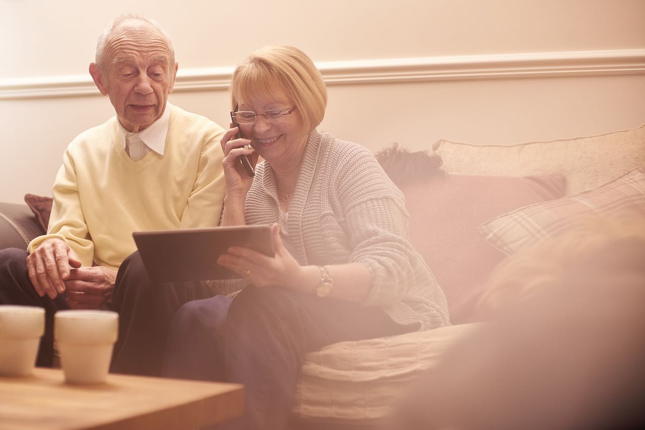 Elderly couple talking about burial insurance