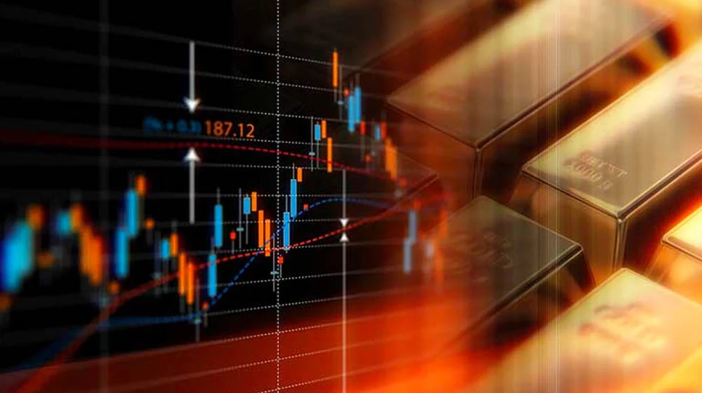 image of a chart next to gold bars