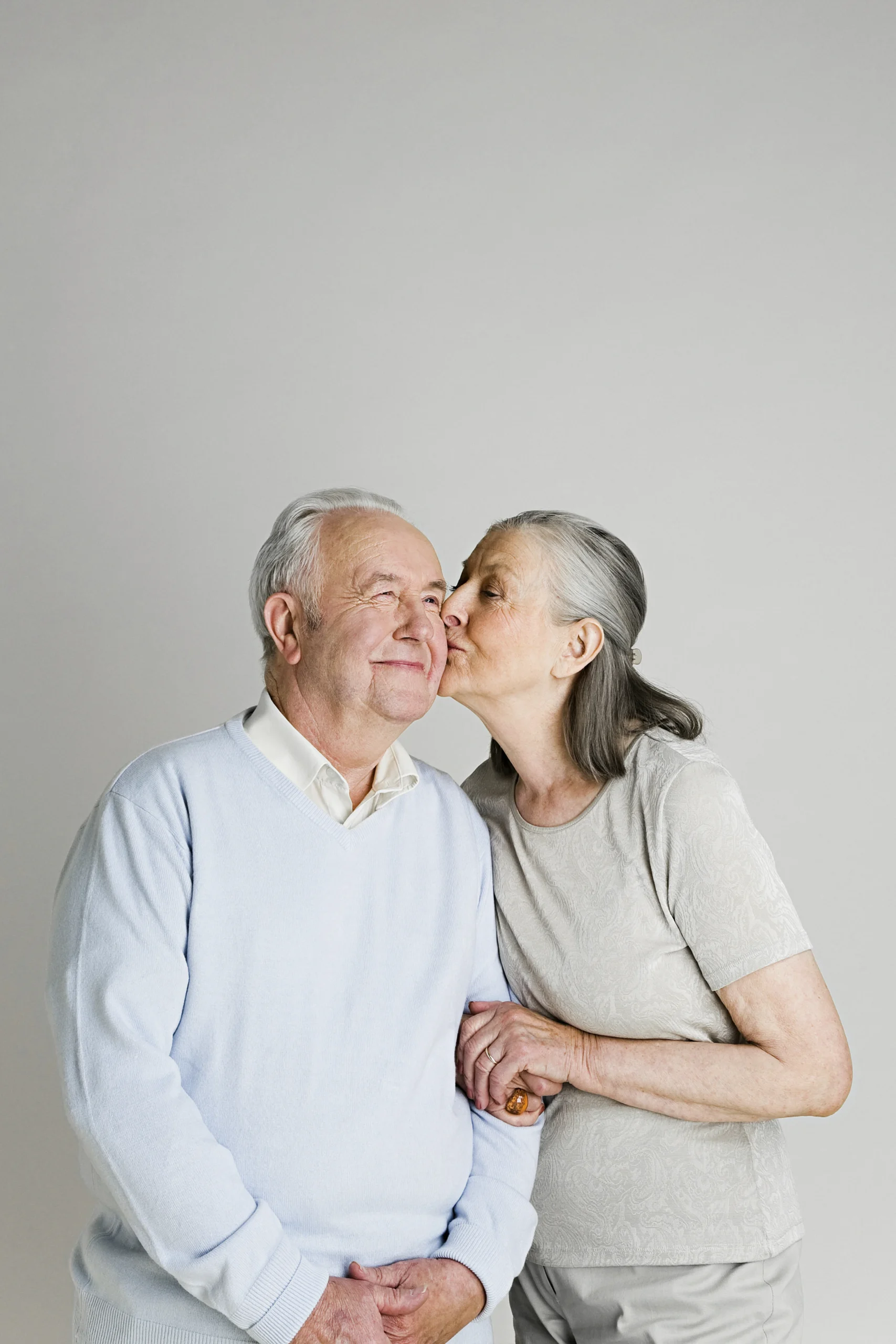 elderly-woman-giving-a-loving-kiss-on-the-cheek