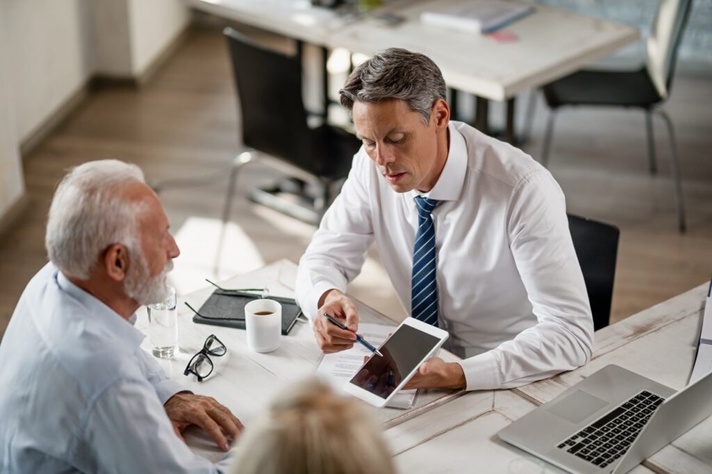 financial-advisor-using-touchpad-while-having-cons