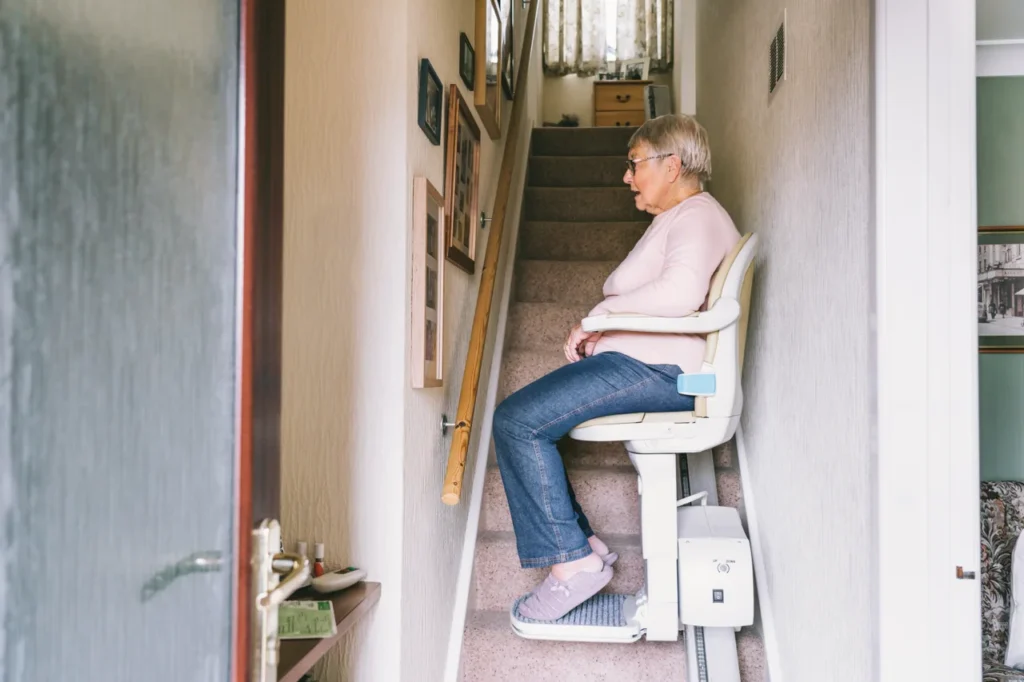 senior-woman-using-automatic-stairlift