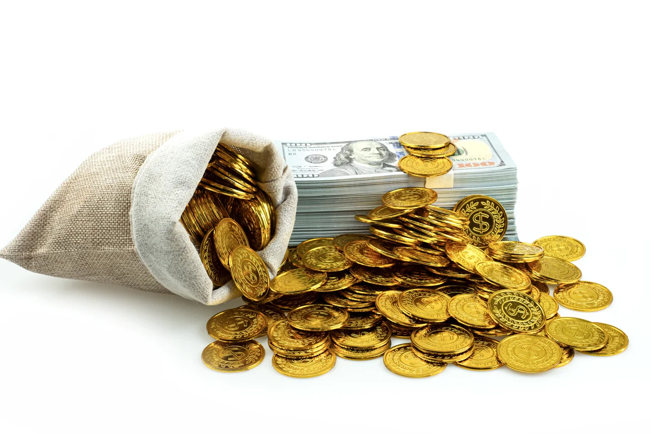 stack-bundles-of-100-us-dollars-banknotes-and-gold