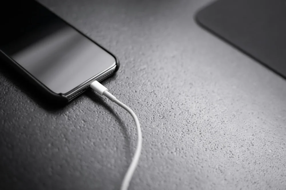 smart phone charging on a table